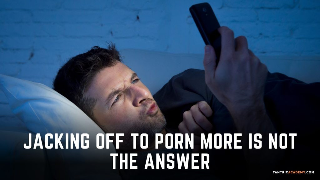 man on his phone in bed